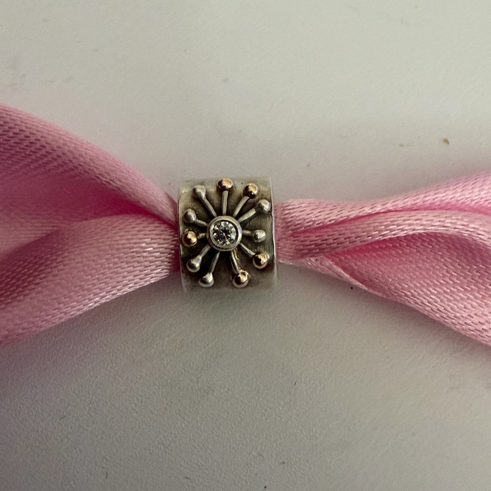 Pandora Silver Floral Burst Bead Charm on Pink Ribbon
